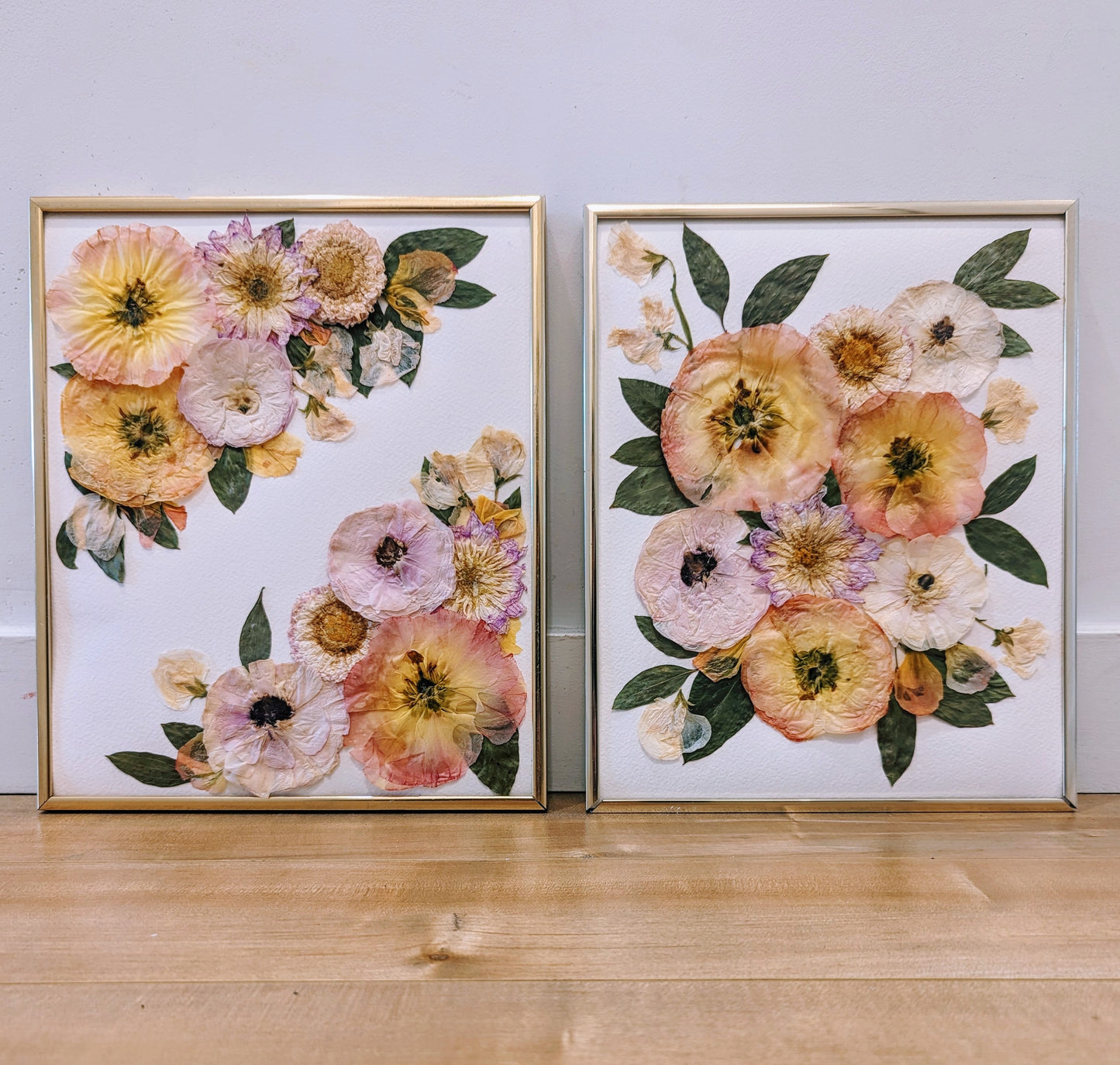 Floral art piece showcasing pressed sunflowers arranged in a vintage frame.