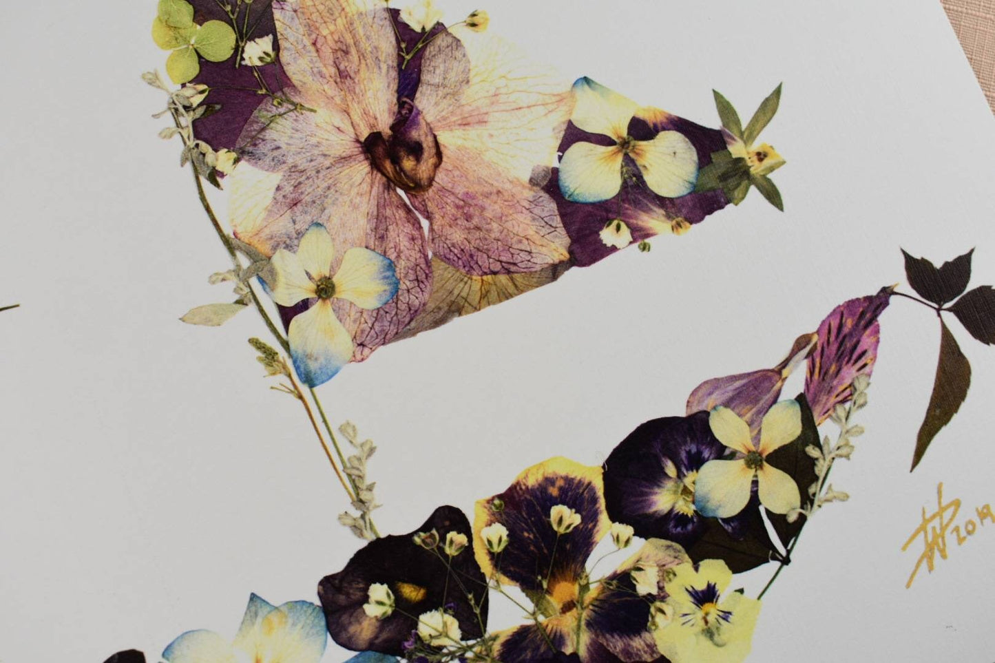 Personalized pressed flower art designed from a bridal bouquet.