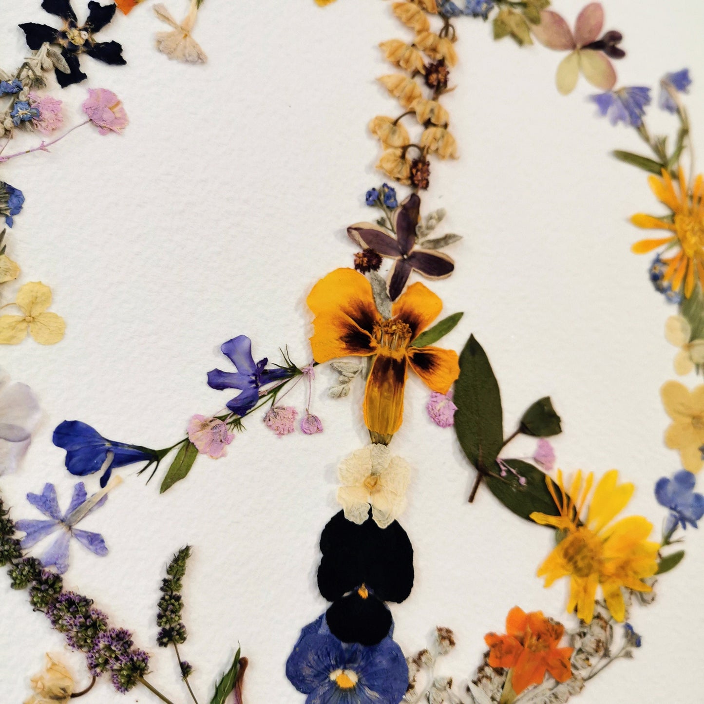 Elegant wedding bouquet preservation displayed as pressed flower art.