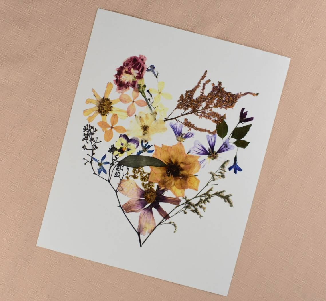Pressed flower art capturing the essence of a preserved bridal bouquet.