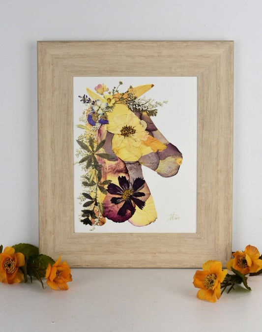 Handcrafted pressed flower art with a mix of bright and pastel blooms.