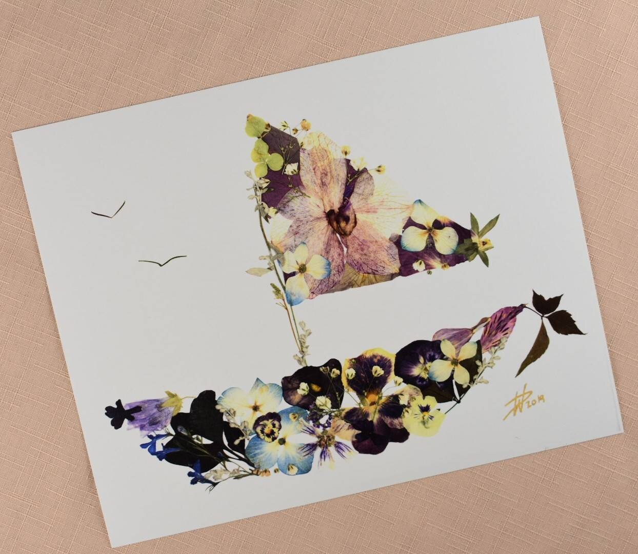 Personalized pressed flower art designed from a bridal bouquet.