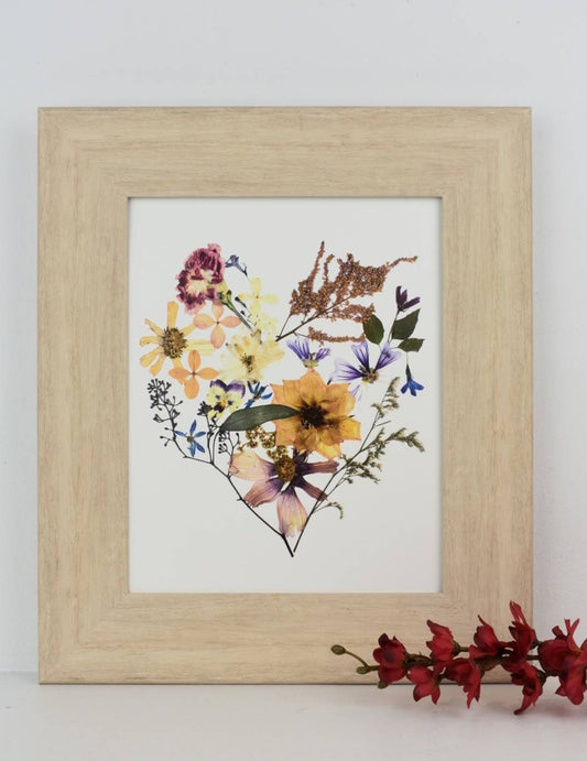 Pressed flower art capturing the essence of a preserved bridal bouquet.
