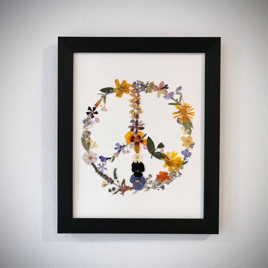 Elegant wedding bouquet preservation displayed as pressed flower art.