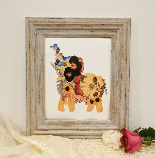 Unique wedding keepsake with pressed flowers arranged in a decorative frame.